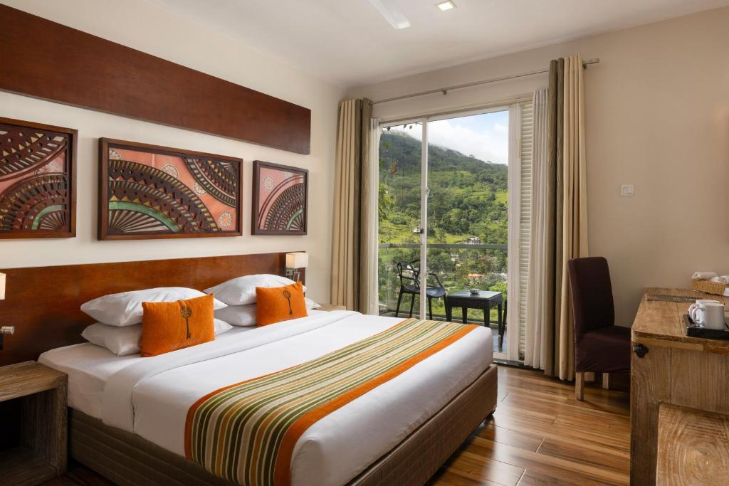 Postel nebo postele na pokoji v ubytování Skyloft Kandy by Aaradhya
