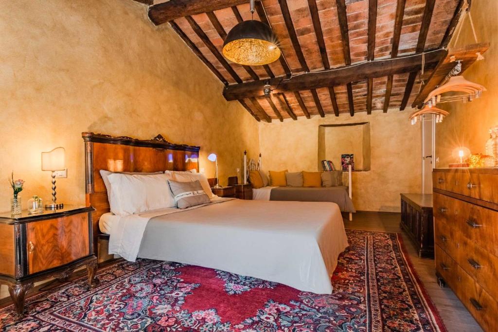 Postel nebo postele na pokoji v ubytování B&B Podere Camaiano