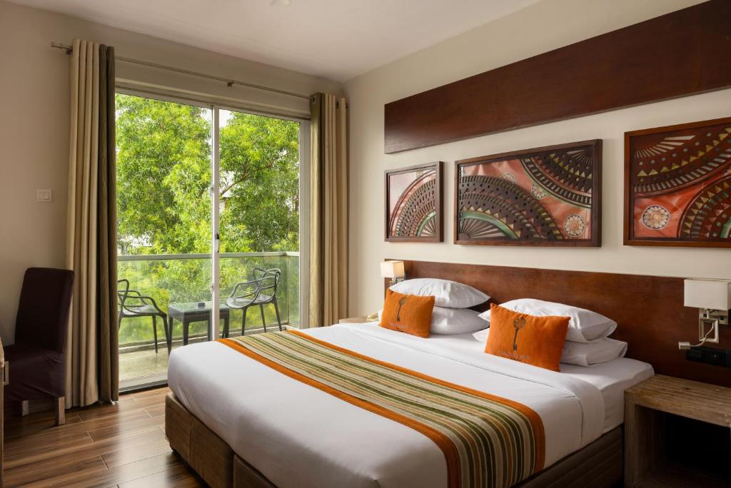 Postel nebo postele na pokoji v ubytování Skyloft Kandy by Aaradhya