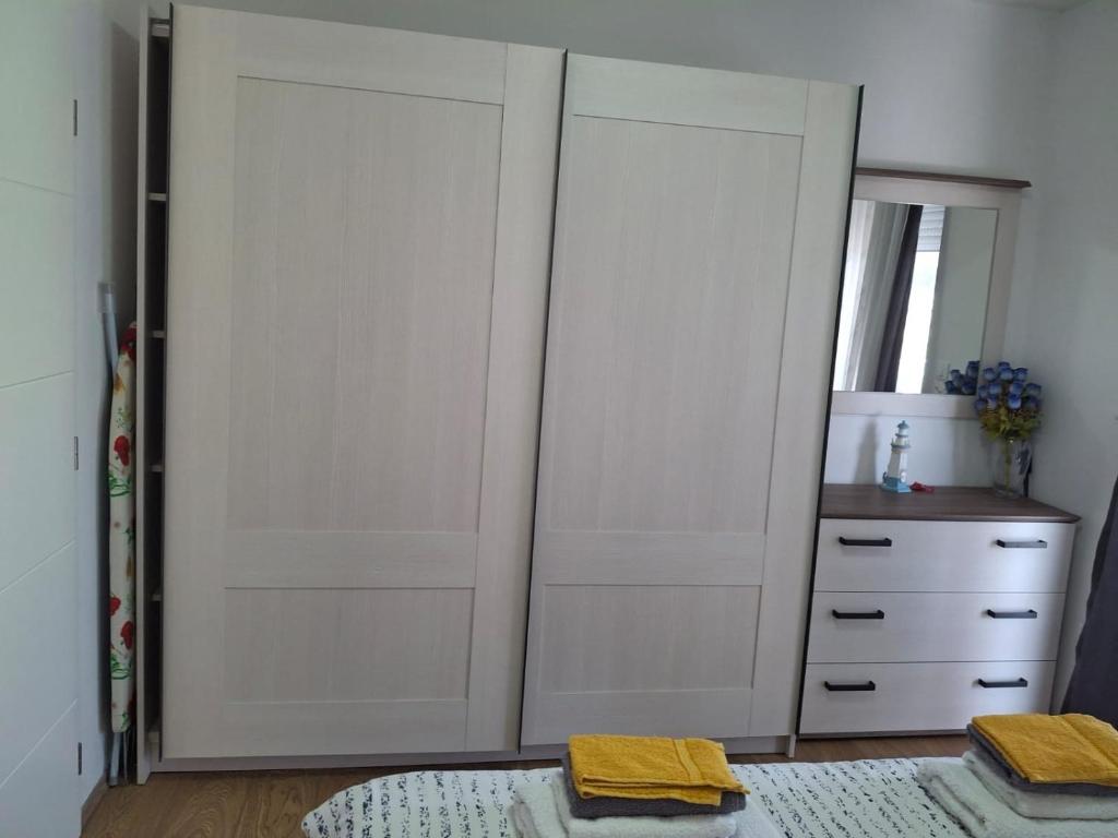 Łóżko lub łóżka w pokoju w obiekcie Apartmani Mirela