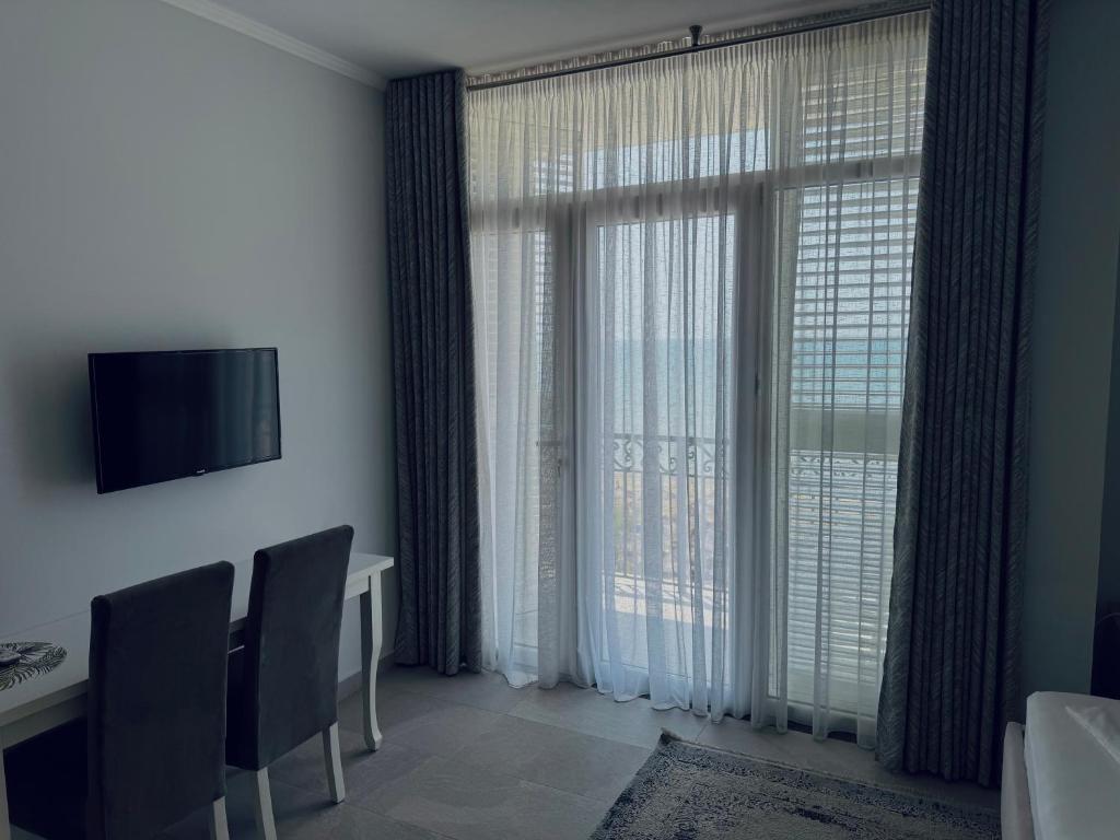 TV a/nebo společenská místnost v ubytování DIELL HOTEL