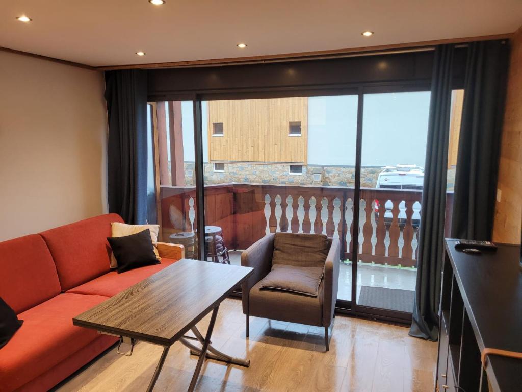 Гостиная зона в Résidence ATHOS C2-1 Chambre-ALPE D'HUEZ-Centre Station