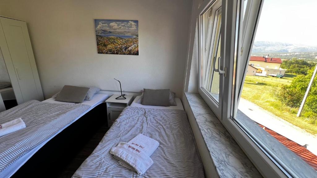 Postel nebo postele na pokoji v ubytování Apartmani Mamić