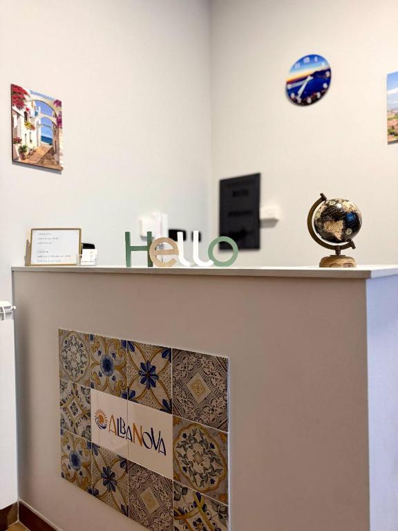 a counter top with a sign on a wall at AlbaNova in Naples