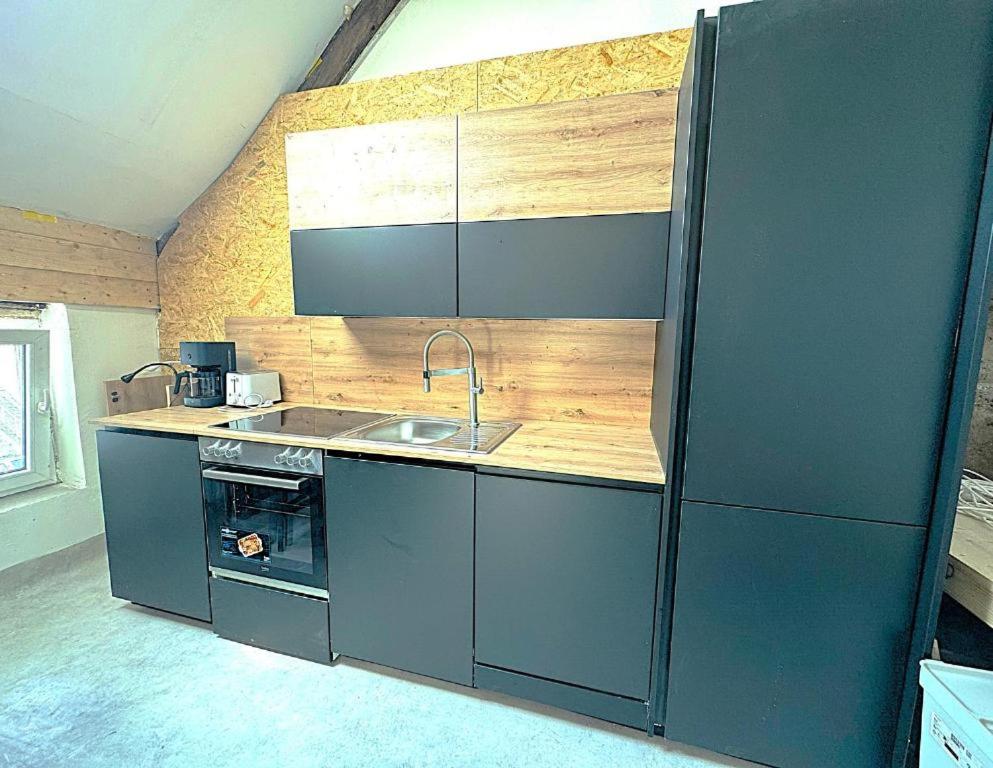 Kuchyň nebo kuchyňský kout v ubytování Vero Home