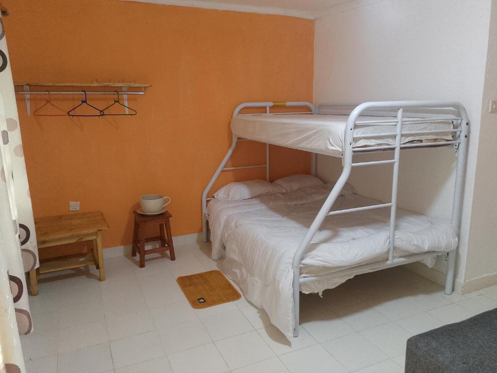 Postel nebo postele na pokoji v ubytování Kakamega Forest Glamping Cabin