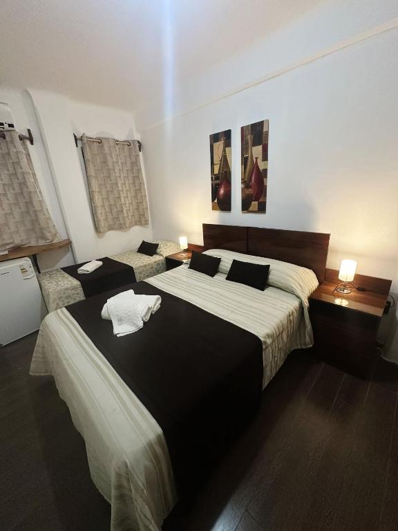 Postel nebo postele na pokoji v ubytování Hotel Esmeralda