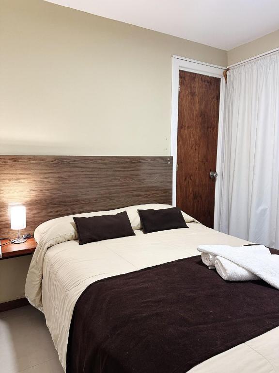 Postel nebo postele na pokoji v ubytování Hotel Esmeralda