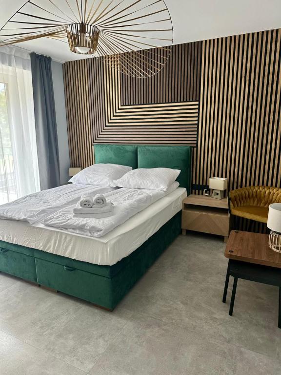 Postel nebo postele na pokoji v ubytování Ramzes 2