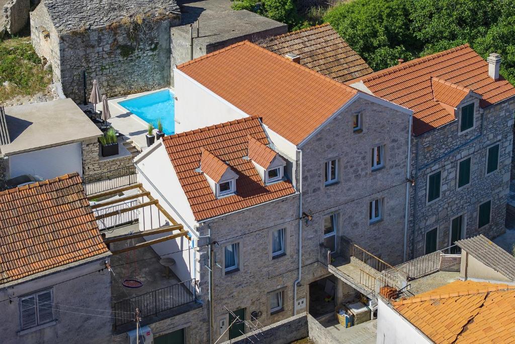 an overhead view of a group of buildings with orange roofs at Vacation House Meri in Blato