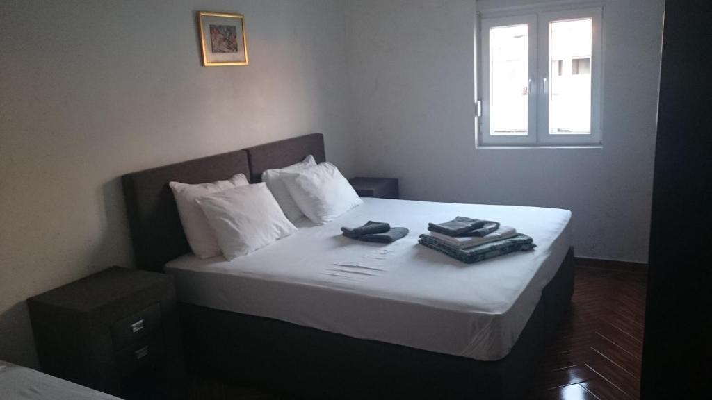 Postel nebo postele na pokoji v ubytování Apart Hotel S Lux