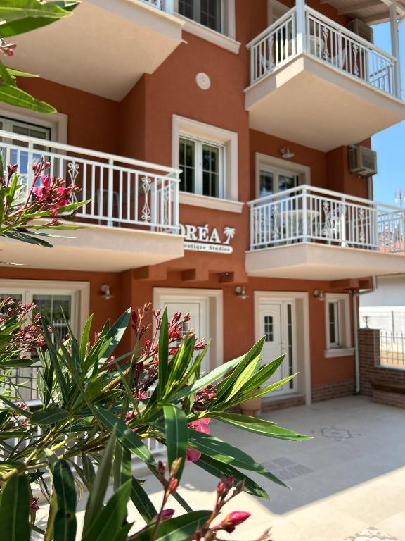 a building with balconies and plants in front of it at Orea Boutique Studios in Asprovalta