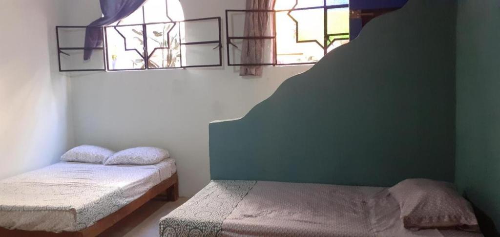 Postel nebo postele na pokoji v ubytování Casa cupo 52 pax 18 habs en Centro de Sayulita especial para bodas intimas
