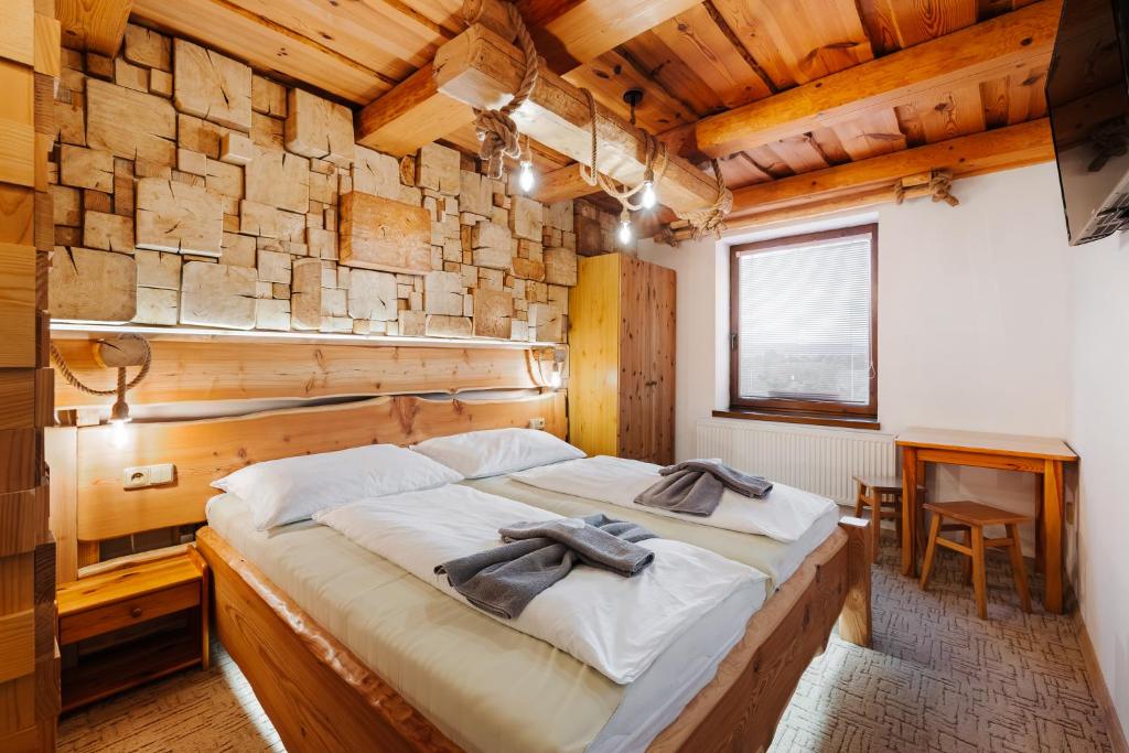 Letto o letti in una camera di Ranč Podlesok