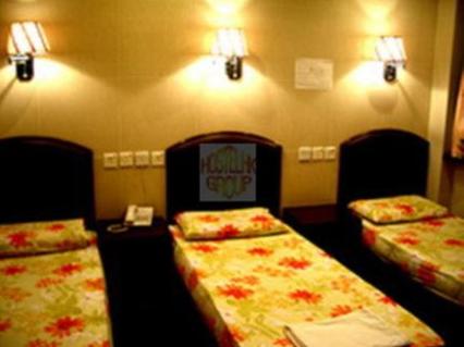Postel nebo postele na pokoji v ubytování 1ST Homestay - HK Tai Wan Hostel