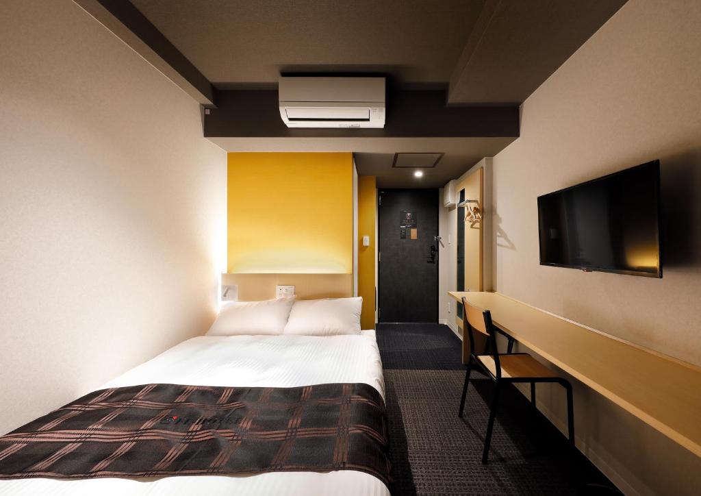 Postel nebo postele na pokoji v ubytování FL Hotel Asakusa