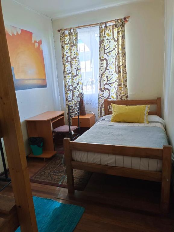 Postel nebo postele na pokoji v ubytování Tipico Hostel Chile