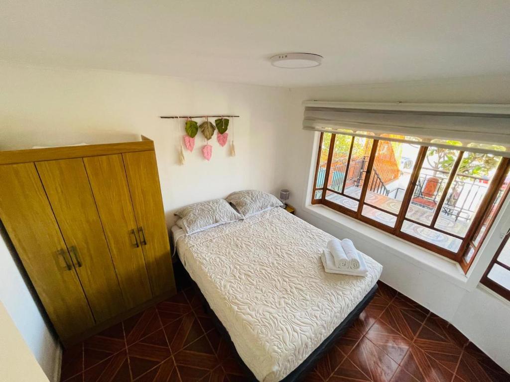 Postel nebo postele na pokoji v ubytování Hostal El Ancla