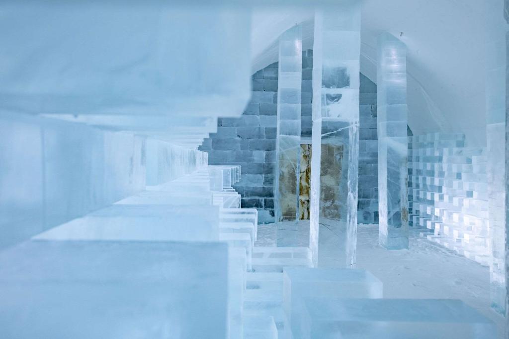 a distorted picture of a building with stairs in it at Ice Hotel in Jukkasjärvi
