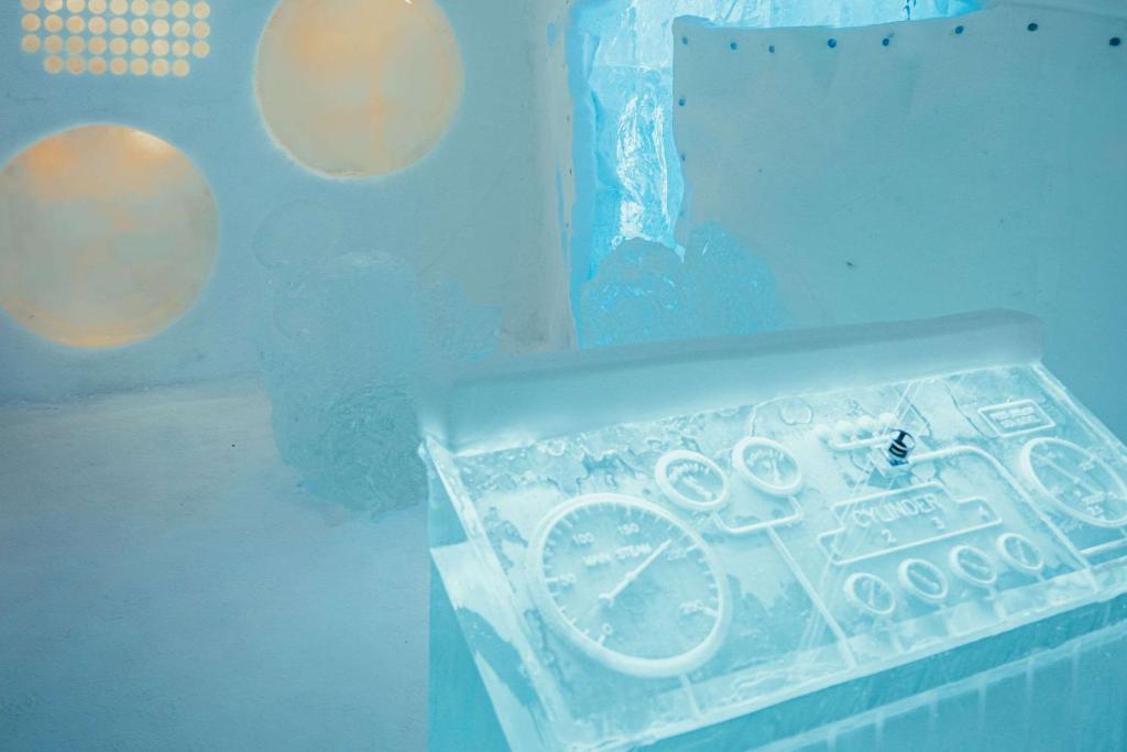 a plastic box with ice on it in a room at Ice Hotel in Jukkasjärvi