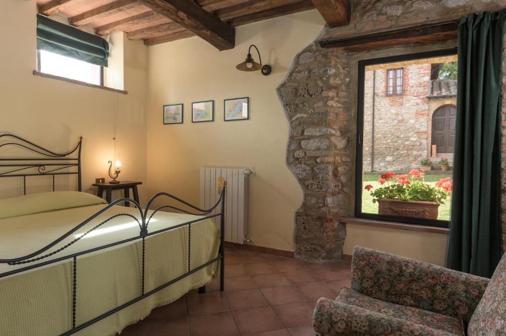 Postel nebo postele na pokoji v ubytování Agriturismo Colli di Travale
