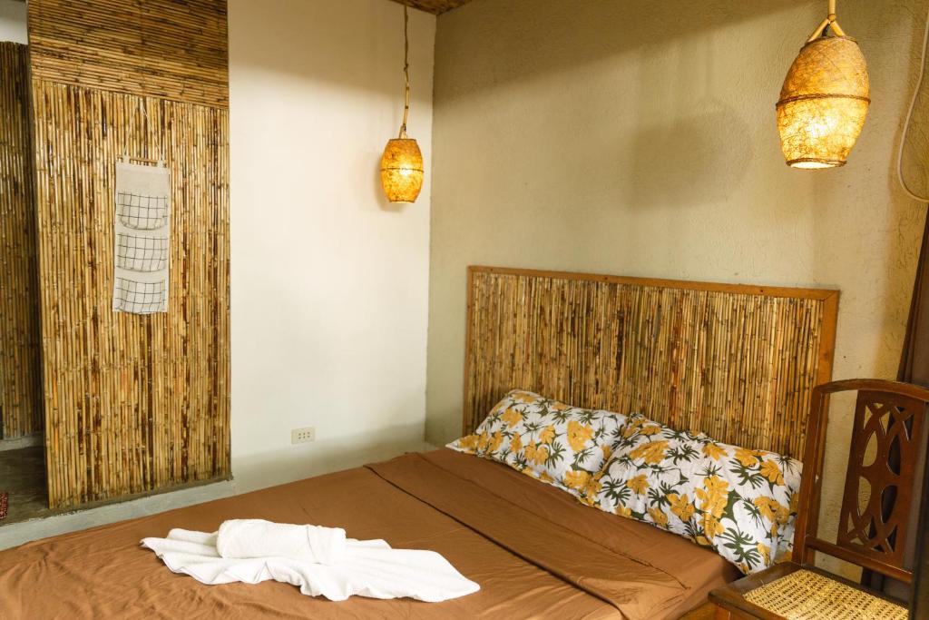Postel nebo postele na pokoji v ubytování katana siargao