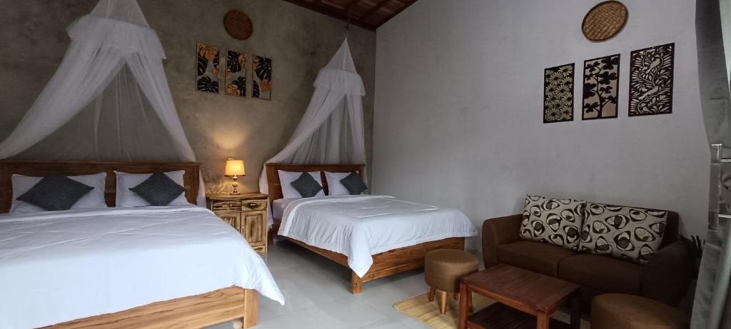 Postel nebo postele na pokoji v ubytování Artomoro Bali