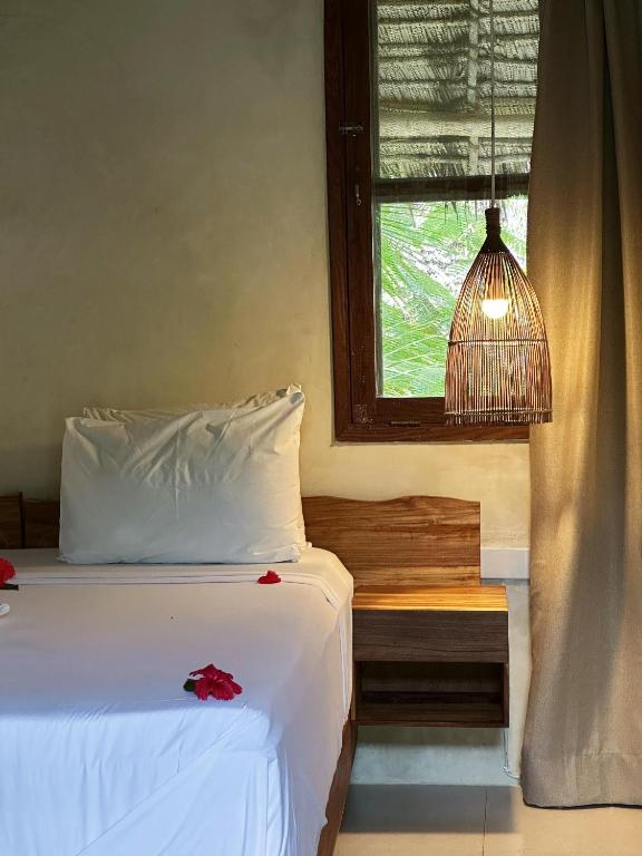 Ein Bett oder Betten in einem Zimmer der Unterkunft Maisha Nungwi - Boutique Hotel