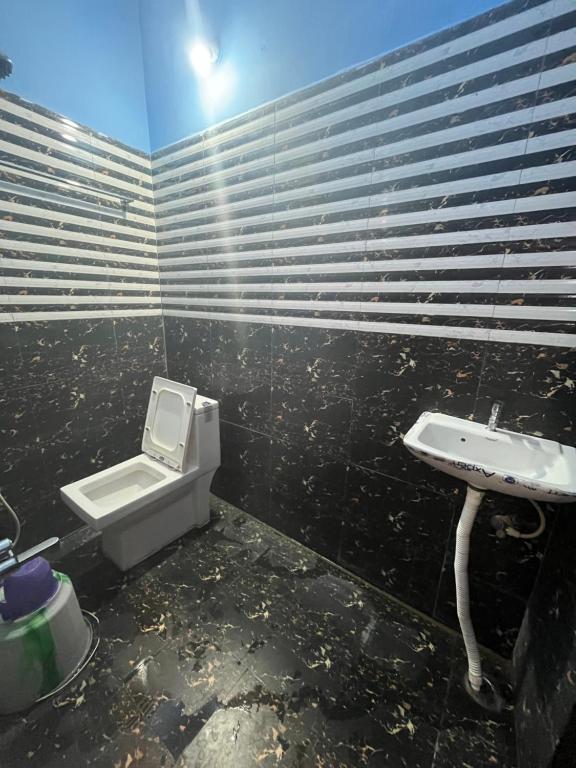 Koupelna v ubytování PANMOZHI RESIDENCY