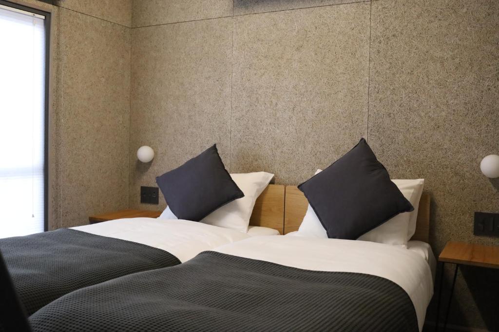 Postel nebo postele na pokoji v ubytování cafe&hostel TMC