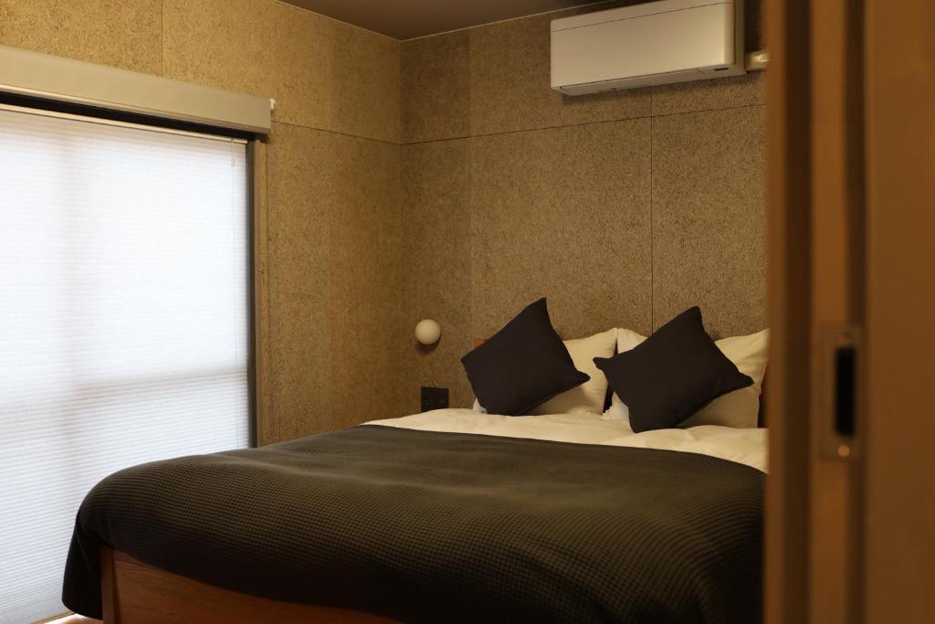 Postel nebo postele na pokoji v ubytování cafe&hostel TMC
