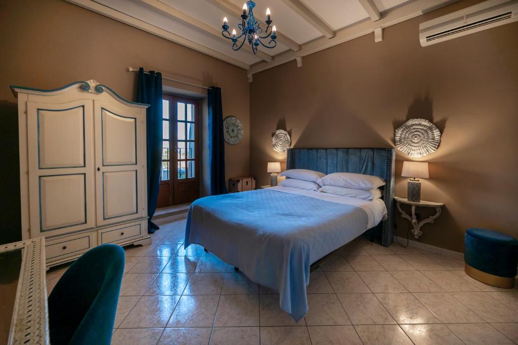 Postel nebo postele na pokoji v ubytování Panorama Suites Noto - Adults Only