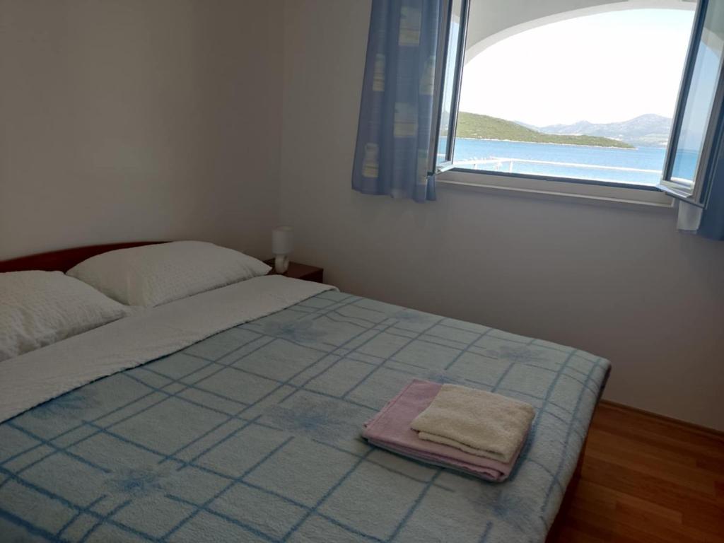 Posteľ alebo postele v izbe v ubytovaní Apartmani Dubravko