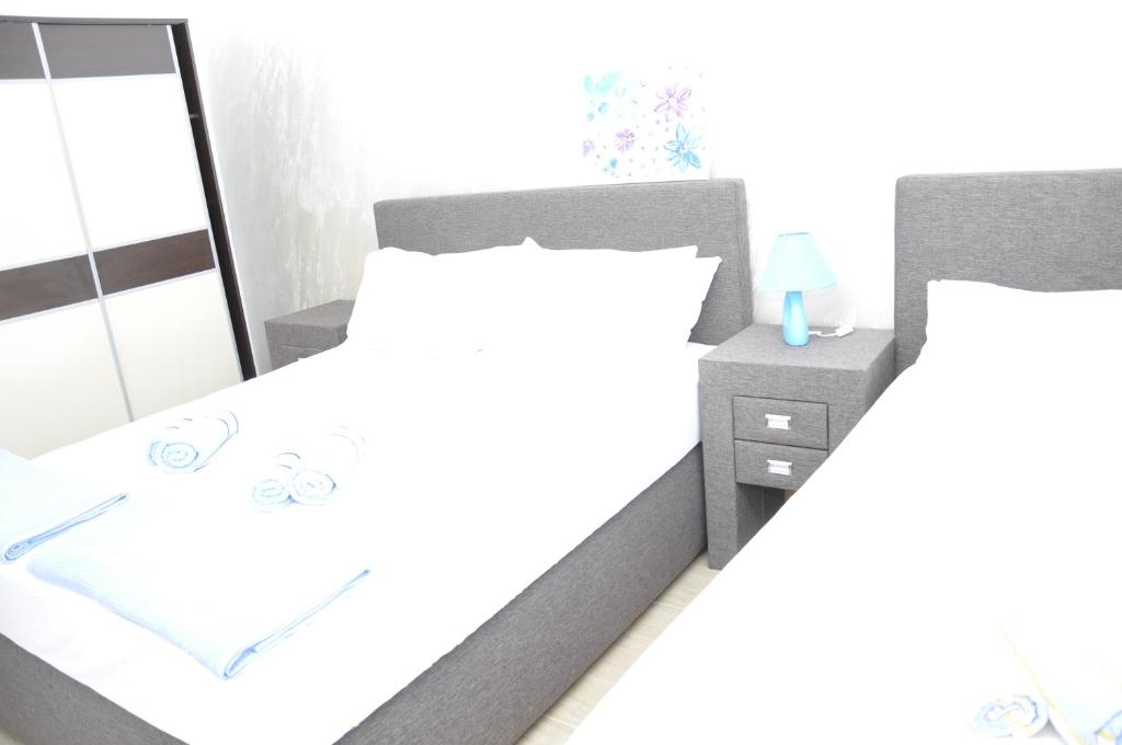Postel nebo postele na pokoji v ubytování Apart Hotel S Lux