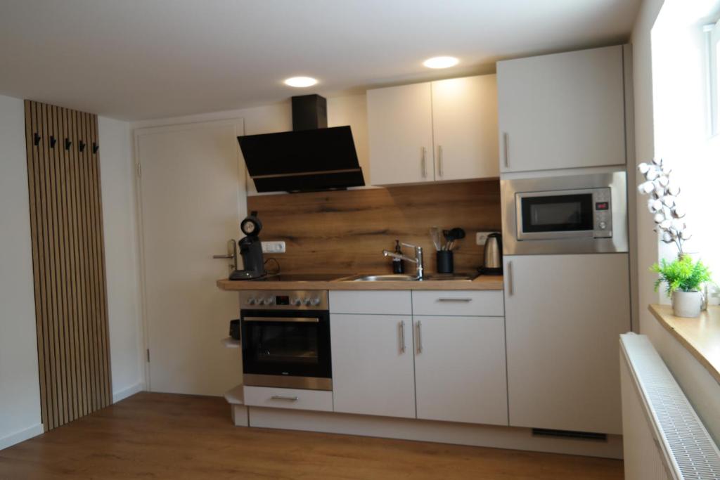 Kuchyň nebo kuchyňský kout v ubytování Apartment 67