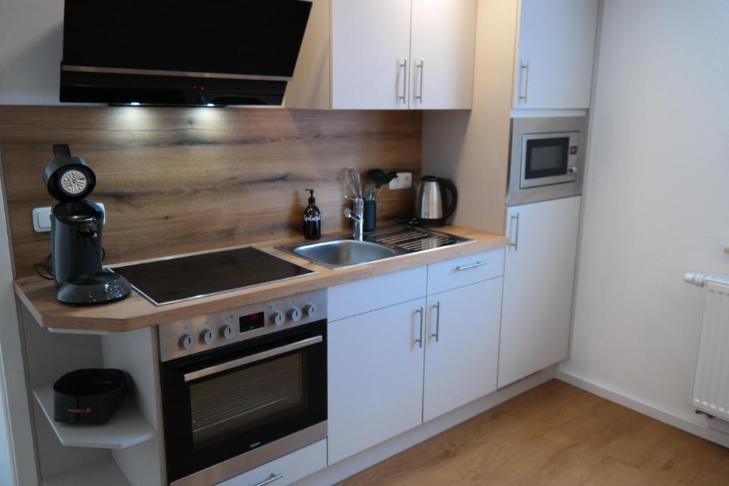 Kuchyň nebo kuchyňský kout v ubytování Apartment 67
