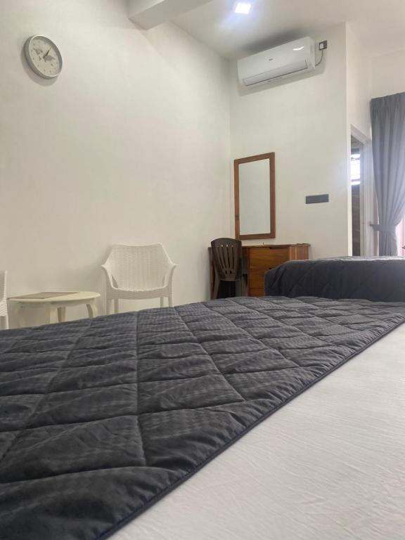Postel nebo postele na pokoji v ubytování Trinco Green Inn uppuveli
