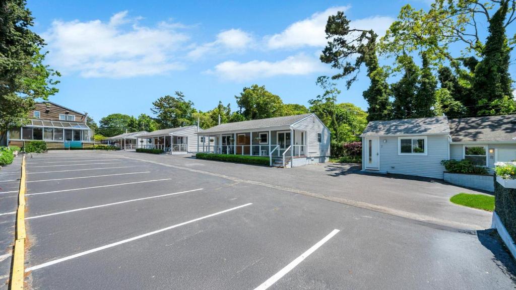 a parking lot in front of a building at The Penny Lane in Hampton Bays