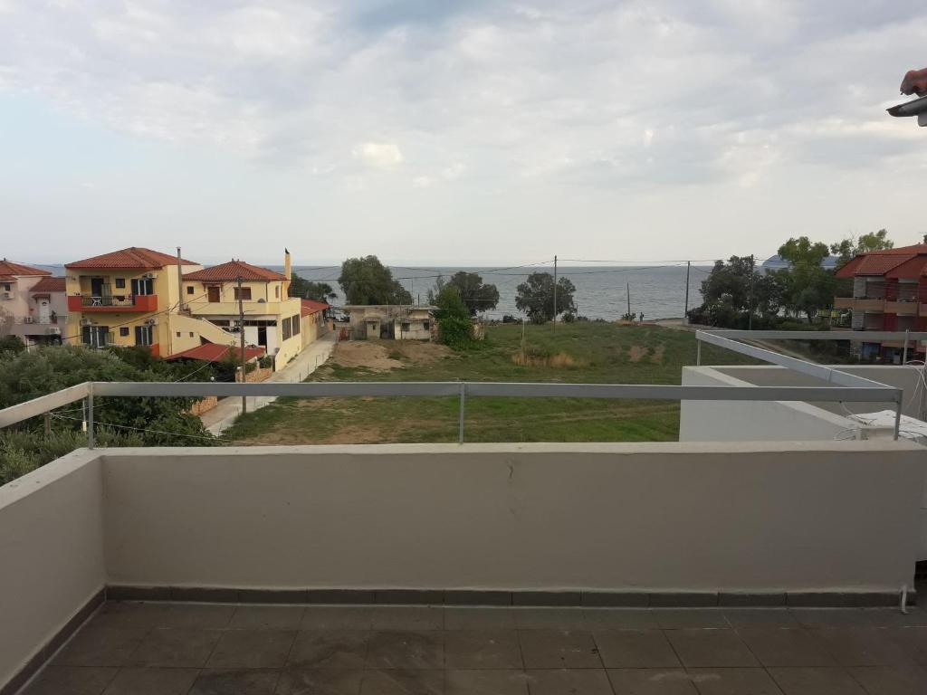 a balcony with a view of the ocean at olivensun studio 12 in Gythio