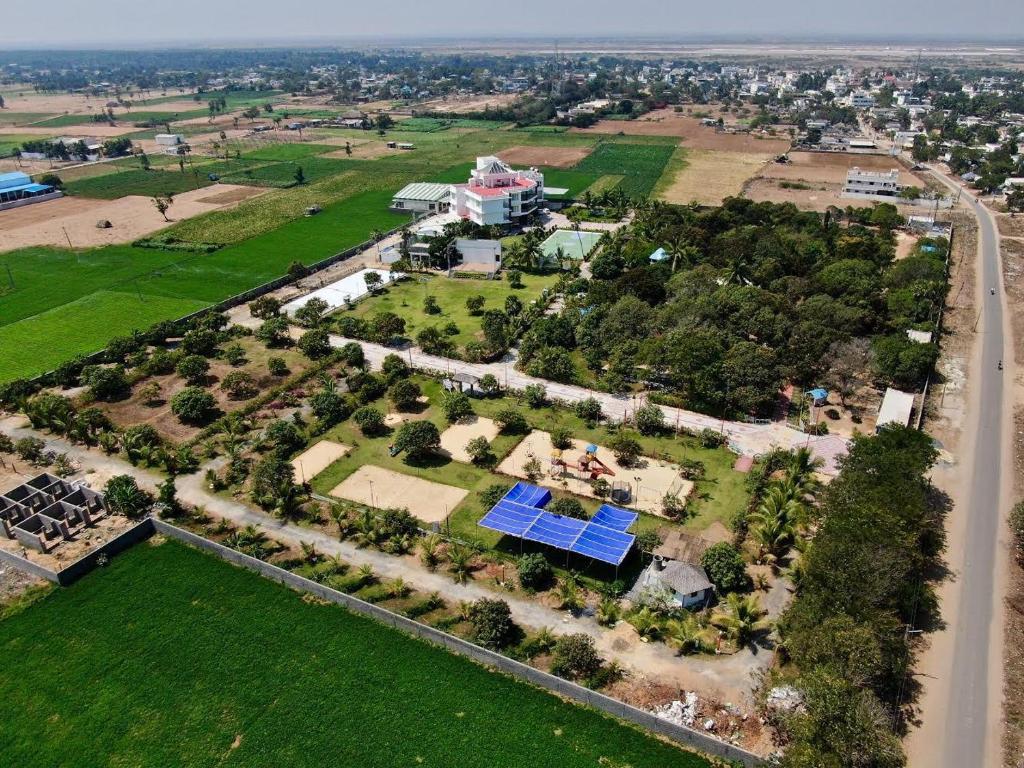an aerial view of a house with a solar array at Nalluri Garden Resort in Kottapatnam