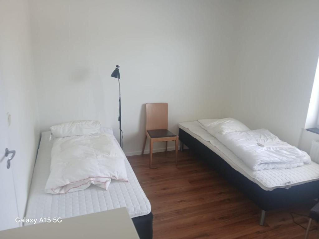 Postel nebo postele na pokoji v ubytování 2 sovrum 3 bäddar 3 sovplatser