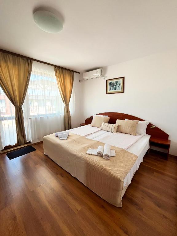 Postel nebo postele na pokoji v ubytování Family Hotel Helios