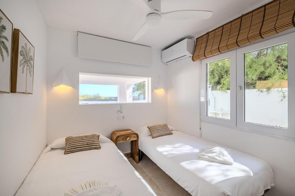 Postel nebo postele na pokoji v ubytování Urbanización El Oasis, 20 Villas en 1ª Línea Playa
