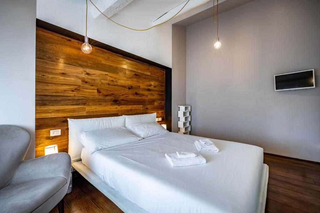 Posteľ alebo postele v izbe v ubytovaní Roommo Fortezza