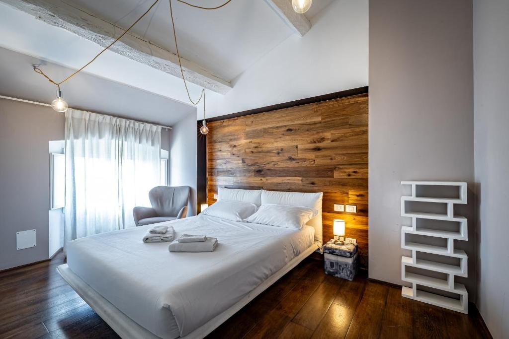Posteľ alebo postele v izbe v ubytovaní Roommo Fortezza