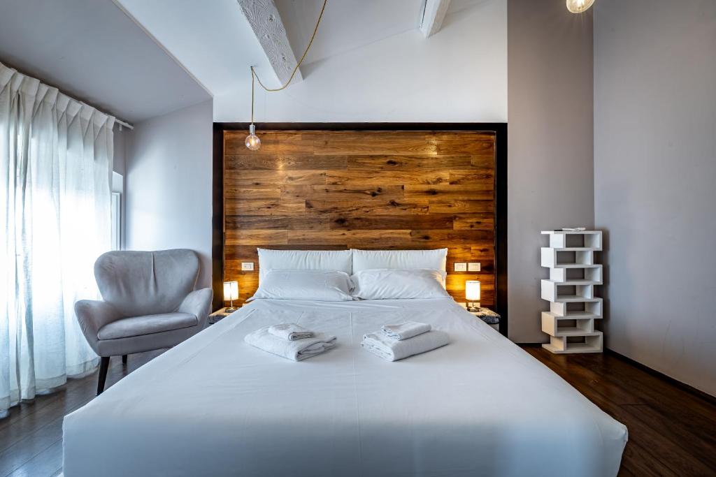 Posteľ alebo postele v izbe v ubytovaní Roommo Fortezza