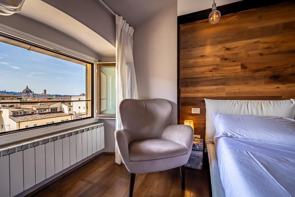 Posteľ alebo postele v izbe v ubytovaní Roommo Fortezza