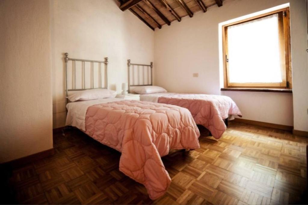Łóżko lub łóżka w pokoju w obiekcie Borgo Santa Cristina