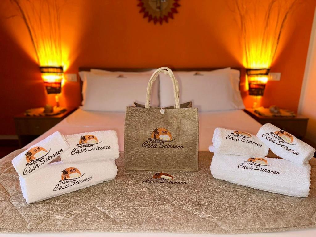 A bed or beds in a room at Tropea Casa Scirocco