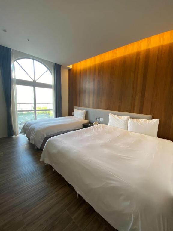 Postel nebo postele na pokoji v ubytování Hledu Hotel